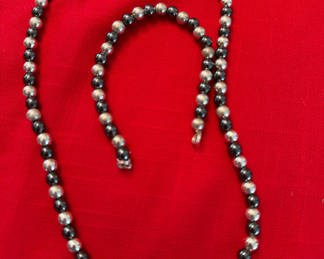 Lot 230: Beaded black and silver necklace and bracelet set