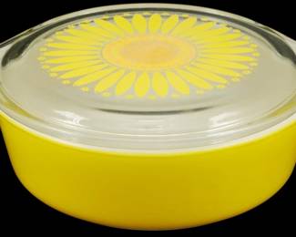 1164 - Vintage Pyrex Sunflower 1 Pint Casserole (Description): Vintage Pyrex Sunflower 1 pint casserole dish  in bright yellow with matching clear glass  lid featuring a decorative yellow sunflower  pattern. The casserole has two side handles  for easy lifting. Measures 2.5" x 8" x 6".