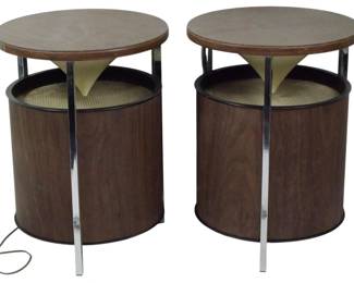 956 - Pair Zenith Circle of Sound Speakers (Description): Pair of Mid Century modern speakers featuring  a distinctive drum-style design. Each  speaker has a round walnut veneer top  supported by chrome vertical supports, with  an exposed cone tweeter visible through the upper grille area. The cylindrical walnut  cabinet houses the main speaker driver. These  speakers showcase classic 1960s-70s design  aesthetics combining warm wood tones with  sleek chrome accents. Measures 13" x 10".