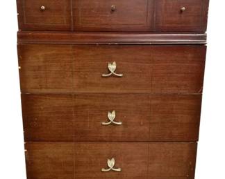 7591 - Vintage Mahogany 4 Drawer Chest (Description): Vintage mahogany four drawer chest featuring  a rich dark finish. The upper section  contains three small drawers with round brass  knobs and decorative inlay borders. The  lower section features three large drawers with distinctive brass leaf-form pulls. The  piece rests on a plinth base. Measures 45  inches high by 35 inches wide by 19 inches  deep.
