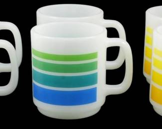 1190 - Set of 6 Vtg Glasbake Striped Mugs 3.5" (Description): Set of six vintage Glasbake striped mugs  measuring 3.5 inches tall. The white milk  glass mugs feature bold horizontal stripes in  a rainbow of colors including red, orange,  yellow, green, blue, and teal gradients. Each mug has a sturdy D-shaped handle typical of  the Glasbake style.