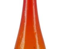 853 - MCM Blenko Crackle Glass Tangerine Decanter (Description): Mid Century Blenko crackle glass decanter in  tangerine. This striking piece features the  signature Blenko crackle texture throughout  the elongated tapered body, transitioning  from deep orange-red at the neck to golden amber at the base. The decanter is topped  with a tall flame-shaped stopper. Measures 23  inches tall.
