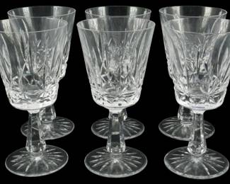 642 - 10 Waterford Rosslare Water Goblets 7" (Description): A set of ten Waterford crystal stemware  glasses. Each piece features the signature  Waterford cut crystal pattern with elegant  faceted stems and starburst bases. Measures 7  inches in height.