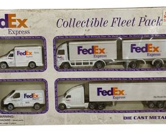 1033 - FedEx Express Fleet Pack Die Cast (Description): FedEx Express Collectible Fleet Pack  collection featuring die cast metal vehicles.  The set includes five FedEx Express branded  vehicles including delivery vans and  semi-trucks with trailers. New in original packaging.