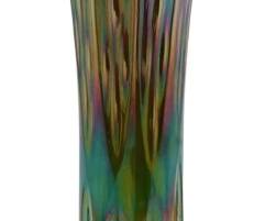 668 - Vintage Iridescent Green Carnival Glass Vase (Description): A vintage iridescent green carnival glass  vase featuring the characteristic rainbow  shimmer and lustrous finish typical of  carnival glass. The vase displays a flared  ruffled rim and elongated form with decorative pressed glass patterning  throughout. Measures 11 inches tall.