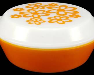 1166 - JAJ Flower Power Covered Casserole 4"x8"x9" (Description): JAJ Flower Power covered casserole dish  featuring a vibrant orange base with a white  lid decorated with orange daisy flowers. This  vintage Pyrex-style piece includes the  original matching lid with tab handles. Measures 4 inches tall by 8 inches wideby 9  inches long.