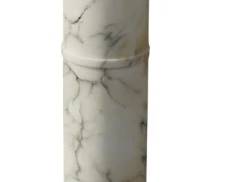 576 - Marble Pillar 40" (Description): A marble pillar measuring 40 inches in  height. The piece features a classical column  design with an octagonal top and base,  displaying natural veining throughout the  stone.