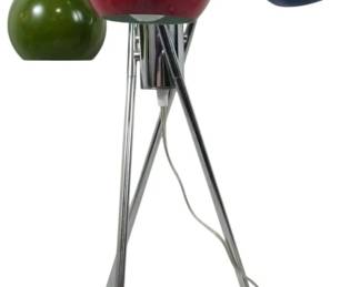 946 - Vintage Italian Tripod Lamp att. Gino Sarfatti (Description): Vintage Gino Sarfatti attributed Italian  colorful lamp featuring a distinctive  mid-century modern design. The lamp showcases  three spherical globe shades in red, blue,  and green, each mounted on adjustable chrome arms extending from a central chrome hub. The  lamp rests on a sleek chrome tripod base  with ball feet, exemplifying the iconic Space  Age aesthetic associated with Sarfatti's  innovative lighting designs.