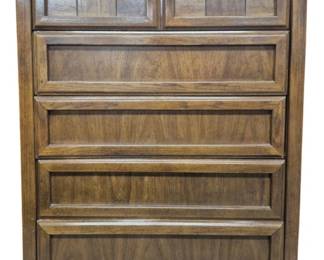 7500 - Dixie Brutalist 5 Drawer Mid-Century Tall Chest (Description): Mid-Century Modern five drawer chest crafted  in walnut with beautiful wood grain  throughout. The piece features a clean,  linear design with three full-width drawers  and two smaller decorative drawers at top that showcase a geometric block pattern  detail. The warm brown tones and quality  construction are characteristic of the era's  furniture design. Measures 50 inches tall by  38 inches wide by 19 inches deep.
