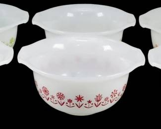 1201 - Glassbake Spring Garden Set of 6 Multi Color (Description): Glassbake Spring Garden set of six  multi-color bowls in white milk glass  featuring decorative floral patterns. The set  includes bowls in blue, red, and green  floral designs, with two bowls in each colorway. Each bowl features a charming  folk-style botanical motif and has tab  handles on either side. Measures 2 1/2" x 5".