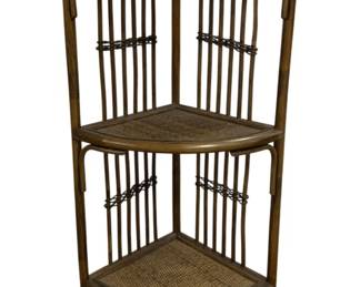 7655 - Wicker 3 Tier Corner Stand 32"x12"x16" (Description): Wicker three-tier corner stand featuring a  curved bamboo frame with rattan-wrapped  accents. The piece has three triangular woven  wicker shelves ideal for corner placement.  The stand displays a warm brown finish with decorative spindle sides and a curved base.  Measures 32 inches tall by 12 inches by 16  inches.