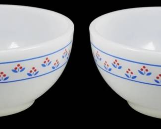 1133 - Pr Termocrisa Red & Blue Floral Bowls 2"x5" (Description): Pair of Termocrisa milk glass bowls featuring  a charming red and blue floral pattern. Each  white bowl is decorated with a band of  stylized flowers in red with blue leaves,  bordered by thin blue lines around the exterior. Measures 2 inches tall by 5inches  in diameter.