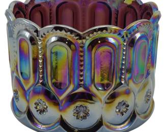 674 - Weisher Amethyst Moon & Stars Carnival Bowl (Description): Vintage Weisher amethyst Moon & Stars pattern  carnival glass bowl featuring a rich  iridescent finish with rainbow hues. The bowl  displays the classic pressed glass pattern  with scalloped rim, elongated oval panels, and decorative medallion motifs around the  base. Measures 5 inches tall by 10 inches in  diameter.
