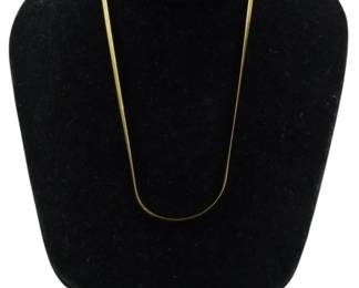 832 - 10Kt Italian Gold Necklace 0.20oz (Description): 10Kt Italian gold necklace featuring a sleek  herringbone chain design. This elegant piece  has a smooth, flat profile that drapes  beautifully. Weight: 0.20oz.