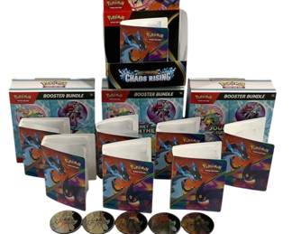 1560 - Pokemon TCG Booster Bundles, Binders & Coins (Description): Lot of assorted Pokemon Trading Card Game  items including three Booster Bundle boxes  from various sets such as Scarlet & Violet  Journey Together and Paldea Evolved, one Mega  Evolution Chaos Rising booster box display, six mini binders featuring Charizard and Mega  Charizard artwork, and five collectible  Pokemon coins. Items appear to be in overall  good condition with some packaging opened.