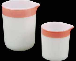 1111 - Pr Vtg HTF Pyrex Mini Creamers Pink Band 3" (Description): Pair of vintage hard-to-find Pyrex mini  creamers featuring a distinctive pink band  around the rim. These charming pieces are  crafted in classic white milk glass with a  coral pink accent stripe at the top. Each creamer features a convenient pour spout.  Measures 3 inches.