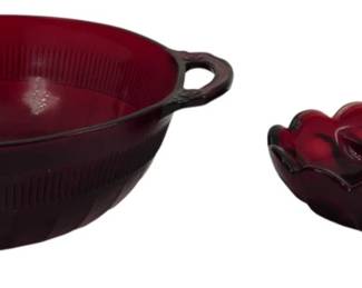 767 - 2 Vintage Ruby Glass Bowls (Description): Two vintage ruby glass bowls. The collection  includes a larger handled bowl with ribbed  interior detailing and a smaller  scalloped-edge bowl with bubble or coin dot  pattern. Both pieces display the deep, rich red coloring characteristic of ruby glass.