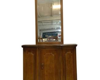 7674 - Fruitwood Console Cabinet w/ Arched Mirror (Description): Vintage fruitwood console cabinet with  coordinating arched mirror. The  hexagonal-front cabinet features paneled  doors with decorative molding and brass  hardware, opening to interior storage. The accompanying wall mirror has a classic arched  top within a rectangular wood frame.  Measures 70 inches tall by 14 inches deep by  34 inches wide.