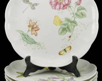 780 - 8 Lenox Butterfly Meadow Plates 4 Patterns (Description): Set of eight Lenox Butterfly Meadow dinner  plates featuring four different patterns. The  porcelain plates display a charming garden  motif with colorful butterflies, dragonflies,  ladybugs, and botanical illustrations including roses, tulips, and delicate foliage  on a white ground. Each plate features a  scalloped edge. Measures 11 inches in  diameter.
