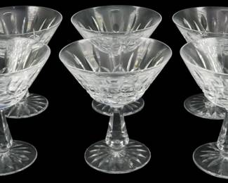 649 - 6 Waterford Rosslare Champagnes 5" (Description): A set of six Waterford sherbet glasses. The  crystal glasses feature the characteristic  Waterford cut pattern with elegant stemmed  bases.