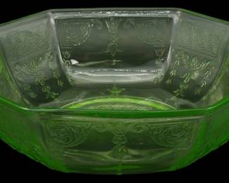 1240 - Anchor Hocking Uranium Glass Princess Bowl (Description): Vintage Anchor Hocking Uranium Depression  Glass Princess pattern bowl. This octagonal  bowl features the classic Princess design  with embossed floral and geometric motifs  throughout the paneled sides. The distinctive green uranium glass exhibits  thecharacteristic glow typical of  Depression-era glassware. The bowl includes  tab handles on opposite sides. Measures 3  inches tall by 9 inches in diameter.