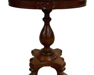 7716 - Victorian Marble Top Side Table 25"x17"x23" (Description): Victorian marble top side table featuring a  white marble surface with natural gray  veining. The carved mahogany base showcases  decorative rose motifs on the apron beneath  the marble top. A turned baluster pedestal rises from a shaped quatrefoil base supported  by four scrolled feet. Measures 25 inches by  17 inches by 23 inches tall.