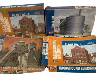 1072 - Assorted HO Scale Model Train Kits (Description): Lot of assorted HO scale model train kits.  The collection includes multiple background  building kits suitable for model railroad  layouts.