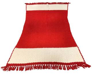 1559 - Vtg Red & White Crochet Afghan Blanket (Description): Vintage handmade crochet afghan blanket in a  bold red and white striped pattern. The  blanket features a textured waffle-style  stitch throughout, with wide red sections  bordered by cream/white stripes at the top and bottom edges. Finished with decorative  red fringe along both short ends. Measures 50  inches by 82 inches.