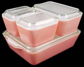 1235 - Pink Pyrex 4pc Refrigerator Dish Set w/ Lids (Description): Pink Pyrex 4-piece refrigerator dish set.  This vintage set features the classic pink  opaque glass in a nesting configuration,  including one large rectangular dish and  three smaller containers. Each piece comes with its original clear ribbed glass lid. The  set displays the iconic mid-century Pyrex  design popular in the 1950s, with all pieces  in the desirable pink colorway.