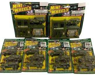 1580 - 6pc Lot Mini Wheels Military Play Sets (Description): Six-piece lot of Mini Wheels military play  sets, all in original packaging. The lot  includes two larger Military Head Quarter  sets featuring M.P. Headquarter buildings  with military trucks and soldier figures, plus four smaller Military vehicle sets with  plastic trucks, jeeps, and figures. All sets  remain sealed on their original blister  cards.