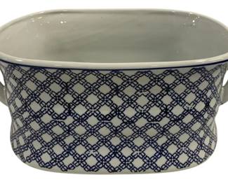 1541 - Blue & White Ceramic Footbath Planter (Description): Blue and white ceramic footbath-style planter  or tub featuring a lattice pattern design  with quatrefoil motifs. The piece has two  side handles and a rolled rim with blue  banding. Measures 19 inches by 13 inches by 8 inches.