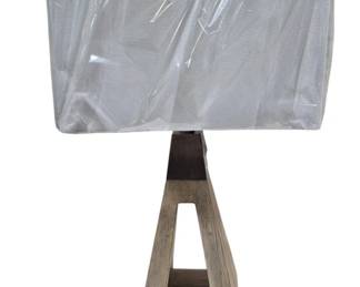 1437 - Stylecraft Table Lamp 28" (Description): Stylecraft table lamp measuring 28 inches in  height. The lamp features a geometric  open-frame base with a modern silhouette.  Please note there is a small chip present. As  is electric/electronic/mechanical item. No guarantee all components present, untested.