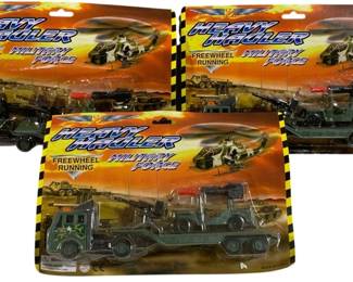 1632 - 3pc Lot Heavy Hauler Military Force Playsets (Description): Three-piece lot of Heavy Hauler Military  Force playsets. Each set features freewheel  running action and includes military vehicles  with trailers and equipment. The playsets  remain in their original packaging and are made in China.