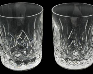 906 - 2 Waterford Lismore Whiskey Glasses 3" (Description): Pair of Waterford Crystal whiskey glasses  featuring the signature Lismore pattern with  its distinctive diamond and wedge cuts. The  cut crystal design catches and refracts light  beautifully. Each glass measures 3 inches in height.