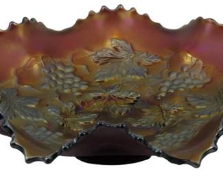 878 - Northwood Amethyst Grape & Cable Carnival Bowl (Description): Vintage Northwood amethyst Grape & Cable  pattern carnival glass dish featuring a  ruffled edge and iridescent finish. The bowl  showcases the classic grape and vine leaf  motif in relief with rich purple-amber iridescence. Measures 2 inches tall by 8  inches in diameter.