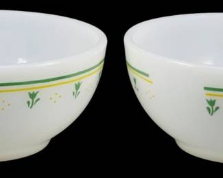 1097 - 2 Vtg Thermocrisa Orange Lattice Yellow Mugs (Description): Pair of vintage Thermocrisa milk glass  stackable mugs featuring an orange lattice  pattern with yellow tulip flowers and dots on  a white background. These charming  mid-century style mugs have the characteristic D-shaped handles and stackable  base design. Measures 3.5" tall.