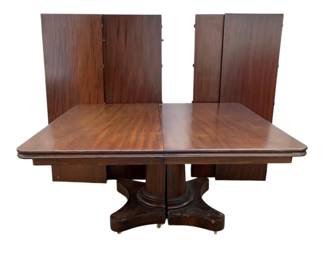 4972 - Empire Mahogany Dining Table w/ 4 Leaves (Description): split pedestal base, 29 x 56 x 56 without  Leaves 29 x 56 x 136 with Leaves Each Leaf is 20" Wide
