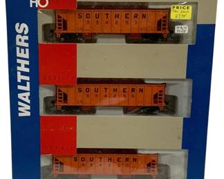 1591 - Walthers HO Gold Line Southern 3pc Train Set (Description): Walthers HO Scale Gold Line ready-to-run  model railroad car set featuring three  Southern Railway hopper cars. The set  includes three orange hopper cars numbered  994253, 994255, and 994260, each bearing the Southern Railway logo and markings. This Gold  Line series features turned metal wheels,  McHenry couplers, and add-on wire grab irons  for select models. The cars remain in their  original packaging.