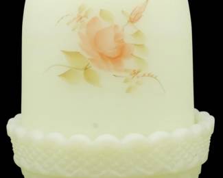 890 - Fenton Burmese Satin Uranium Glass Fairy Lamp (Description): Vintage Fenton Burmese satin uranium glass  fairy lamp featuring a dome-shaped shade with  hand-painted peach rose and green foliage  decoration. The shade rests on a quilted  diamond pattern base with a scalloped rim and footed bottom. The custard-colored glass  exhibits the characteristic soft yellow-peach  coloration of Burmese glass. Measures 5  inches tall.