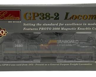 1598 - Proto 2000 GP38-2 HO Scale Locomotive (Description): Proto 2000 Limited Edition GP38-2 locomotive  in HO scale. This Seaboard System diesel  locomotive, numbered 2680, features Proto  2000 magnetic knuckle couplers and comes  factory assembled. Part of the Proto 2000 Series, setting the standard for excellence  in model railroading.