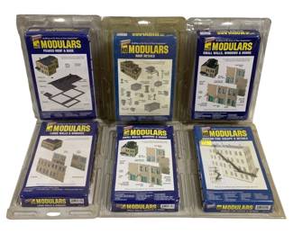 1678 - 6pc Lot Cornerstone HO Scale Modulars Kits (Description): Lot of six Cornerstone HO scale Modulars  model building kits. The collection includes  Peaked Roof & Base, Roof Details, Small Walls  Windows & Doors (two sets), Large Walls &  Windows, and Modern Fire Escape & Details. All kits appear to be factory sealed in  original packaging. These modular components  are designed to work together, allowing model  railroad enthusiasts to create customizable  urban structures and buildings.