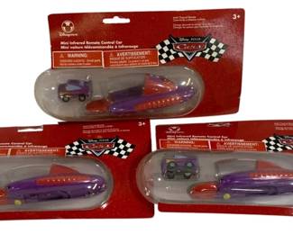 1038 - 3 Disney Store Cars Mini Remote Control (Description): A three-piece lot of Disney Store Cars mini  remote control cars. Each car comes in  original retail packaging featuring the  Disney Pixar Cars branding.