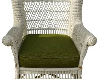 571 - Wicker Chair 37"x28"x23" (Description): A wicker chair measuring 37 inches high by 28  inches wide by 23 inches deep. The chair  features a high back design with woven wicker  construction and includes a cushion.