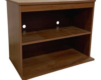 7677 - Wooden Shelving Unit 28"x24"x16" (Description): Wooden shelving unit featuring a warm  walnut-toned finish with two open shelves.  The upper shelf includes two cord management  holes in the back, making it suitable for use  as a TV or media stand. The unit has a simple, contemporary design with clean lines  and a low profile base. Measures 28" x 24" x  16".