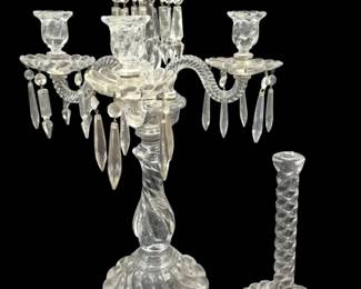 1440 - Fostoria Colony Candelabra Parts 24" (Description): Fostoria Colony crystal candelabra parts  measuring 24 inches. The lot includes a  four-arm candelabra with twisted glass arms,  hanging crystal prisms, and tulip-shaped  candle cups on a swirled pedestal base. One arm is broken as noted in photo. Also  included is a candlestick base and top with  metal fitting. The pieces feature the  characteristic swirl pattern of the Colony  line.