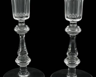 646 - Pair Waterford Crystal Candlesticks 8" (Description): A pair of Waterford crystal candlesticks  featuring elegant turned stems with fluted  cup tops and circular bases. Each candlestick  measures 8 inches in height.