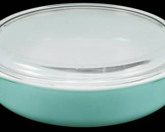 1225 - Pyrex Turquoise Casserole w/ Lid (Description): Pyrex turquoise casserole dish with clear  glass lid. The dish features the classic  mid-century aqua blue exterior with white  interior and integrated side handles.  Complete with original clear glass lid. Measures 2.5" x 11" x 9".