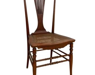 7666 - Chippendale Style Coffee Table 18"x32"x20" (Description): Chippendale style coffee table featuring a  shaped top with raised gallery edge and a  scalloped apron. The table rests on carved  cabriole legs with acanthus leaf detailing at  the knees, terminating in ball and claw feet. Crafted in a warm walnut finish.  Measures 18 inches high by 32 inches wide by  20 inches deep.