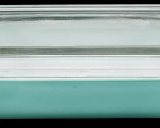1123 - Vtg Pyrex Turquoise Casserole Dish w/ Lid (Description): Vintage Pyrex turquoise casserole dish with  clear glass lid. The rectangular baking dish  features the classic mid-century turquoise  color that Pyrex was known for during the  1950s and 1960s. Measures 3 1/2 inches tall by 11 inches long by 7 inches wide.