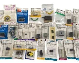 1642 - Lot Vintage Electronic Components & Parts (Description): Lot of vintage computer and electronic parts,  primarily consisting of new old stock  components in original packaging. The  collection includes various Radio Shack  components such as bridge rectifiers, reed relays, photocells, resistors, diodes, and IC  sockets. Also featured are Peco Lectrics  model railway electrical components, a  Walthers model railroad item, and assorted  transistors, capacitors, and other electronic
